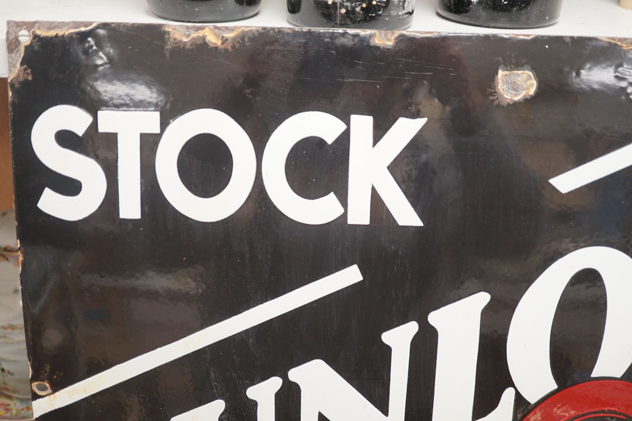 A Dunlop stock enamelled sign 43cm sq